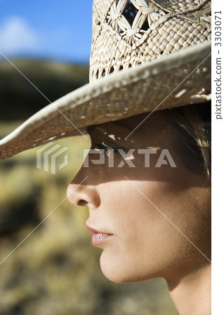 Woman in straw hat. Woman in straw hat. 3303071