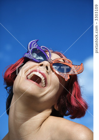 Woman wearing unique sunglasses. 3303109