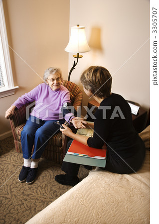 Elderly Woman Having Blood Pressure Taken 3305707