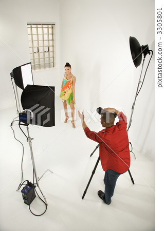 Man photographing pretty female model. Man photographing pretty female model. 3305801