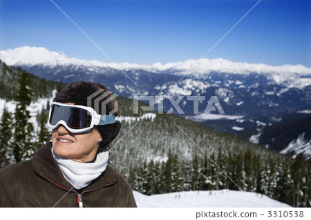 Woman skier in mountains. 3310538