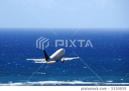 Airplane over ocean. 3310939