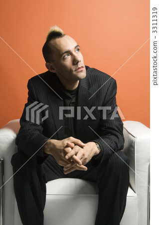 Man with mohawk wearing suit. Man with mohawk wearing suit. 3311319