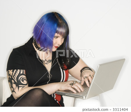 Woman on laptop computer. 3311404