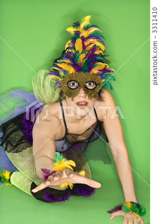 Woman in Mardi Gras costume. 3311410