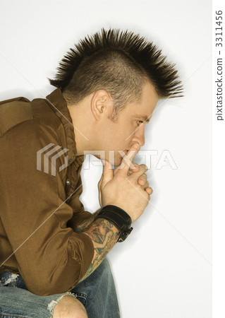 Man with tattoos and mohawk. 3311456