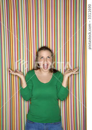 Woman shrugging with mouth open. Woman shrugging with mouth open. 3311690