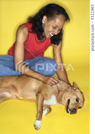 Woman petting dog. 3311965