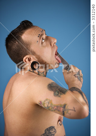 Man holding knife to tongue. 3312140
