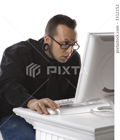 Adult male using computer. 3312152