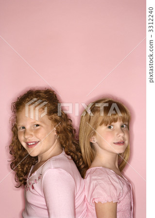 Girls standing back to back. 3312240