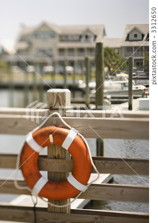 Life preserver on dock. Life preserver on dock. 3312650