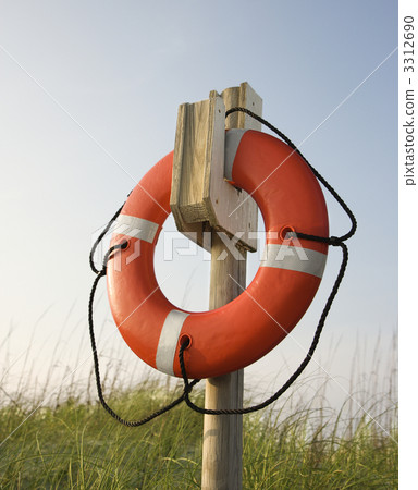 Life preserver hanging on post. 3312690