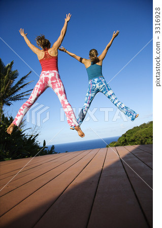 Women jumping into air. 3316928