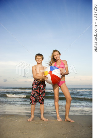Boy and girl on beach. Boy and girl on beach. 3317250