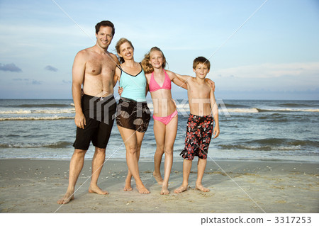 Happy smiling family on beach. 3317253