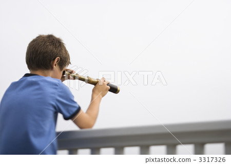 Boy looking through telescope. 3317326