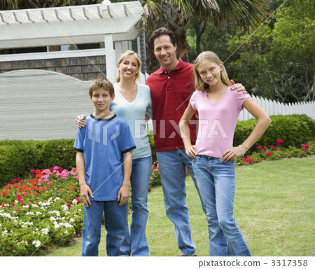 Portrait of family in yard. 3317358