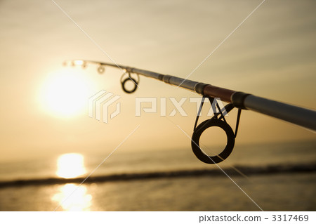 Fishing pole at sunset. Fishing pole at sunset. 3317469