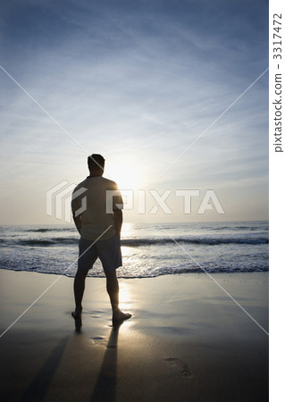 Man alone on beach. 3317472
