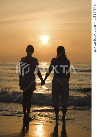 Mom and daughter at sunrise. Mom and daughter at sunrise. 3317478