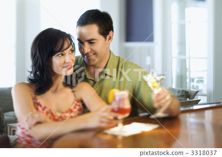 Couple at Bar Smiling and Drinking Couple at Bar Smiling and Drinking 3318037