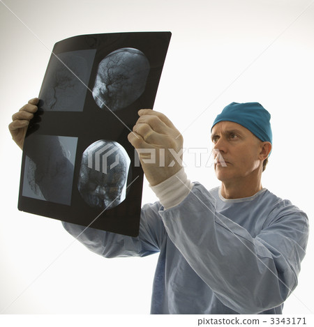 Doctor reading x ray. Doctor reading x ray. 3343171