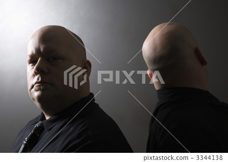 Twin men back to back. 3344138