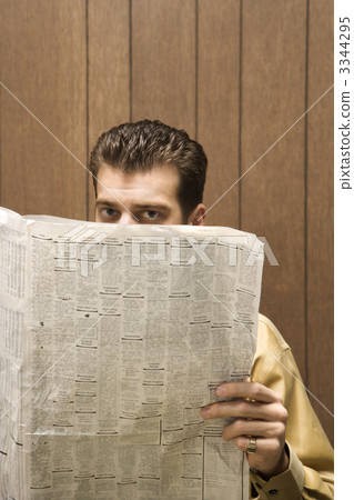 Businessman reading newspaper. Businessman reading newspaper. 3344295