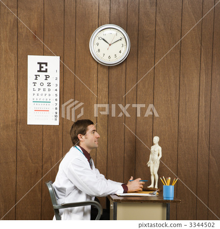 Doctor at desk. 3344502