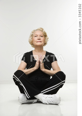 Senior woman meditating. 3345102