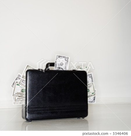 Briefcase overflowing with money Briefcase overflowing with money 3346406