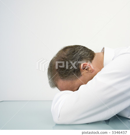 Businessman with head on desk Businessman with head on desk 3346437