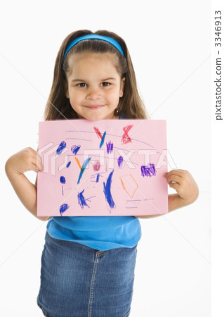 Smiling hispanic girl holding drawing. 3346913