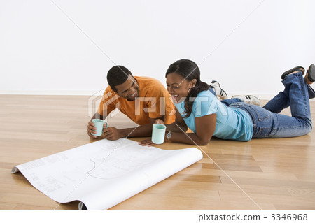 Couple with blueprints. 3346968