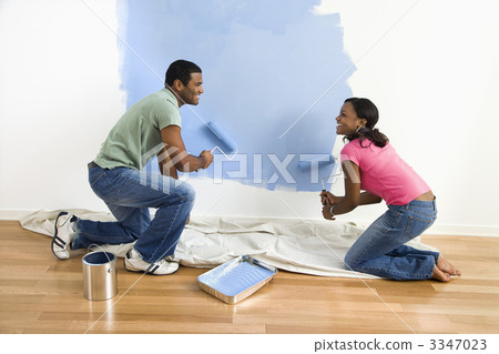 Couple painting wall. 3347023