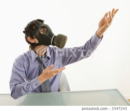 Man wearing gas mask gesturing. 3347243