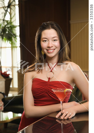 Woman at bar with drink. Woman at bar with drink. 3350386