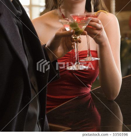 Couple with martinis. 3350396
