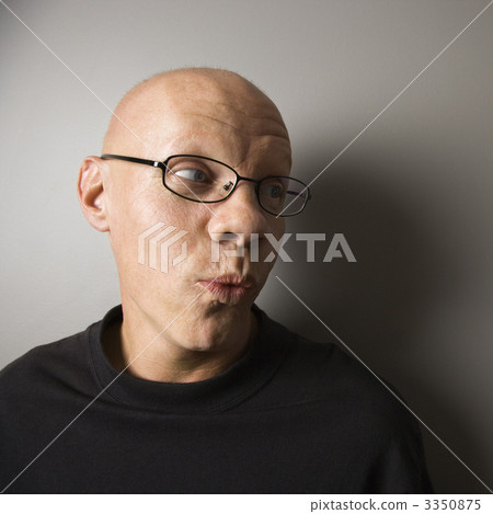 Man with puckered lips. 3350875