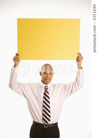 Businessman holding blank sign. Businessman holding blank sign. 3351040