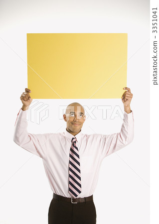 Businessman holding blank sign. Businessman holding blank sign. 3351041