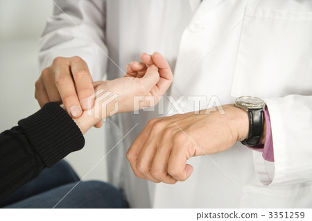 Doctor taking patient's pulse. Doctor taking patient's pulse. 3351259
