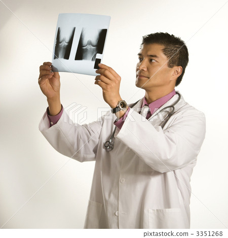Doctor examining x-ray. Doctor examining x-ray. 3351268