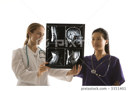 Doctors analyzing x-ray. 3351401