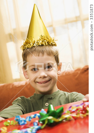 Boy holding birthday gift. 3351873