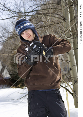 Teenager making snowball 3352660
