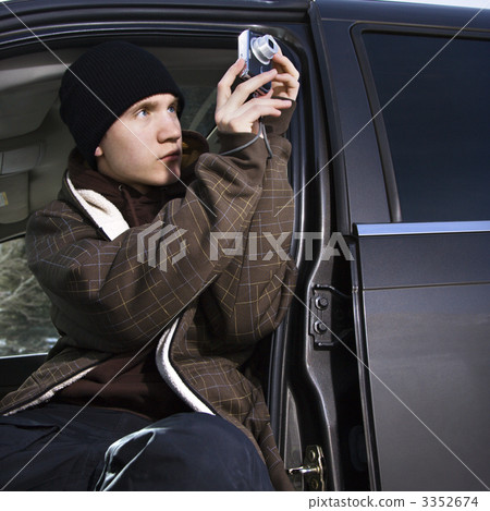 Teenager taking a picture. 3352674