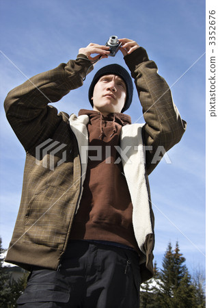 Teen taking picture. 3352676