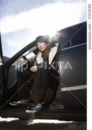 Teen sitting in car. 3352686